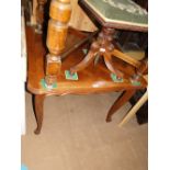 A French parquetry topped draw leaf dining table on cabriole legs.