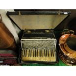 Vintage piano accordion in case.