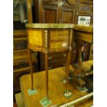 A pair of reproduction rosewood bow front side tables, with pierced brass galleries,