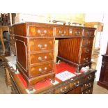 A small reproduction mahogany twin pedestal writing desk.