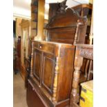 A Victorian mahogany chiffonier with raised back and panelled doors.