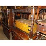 An Antique oak side table with carved frieze and baluster turned legs.