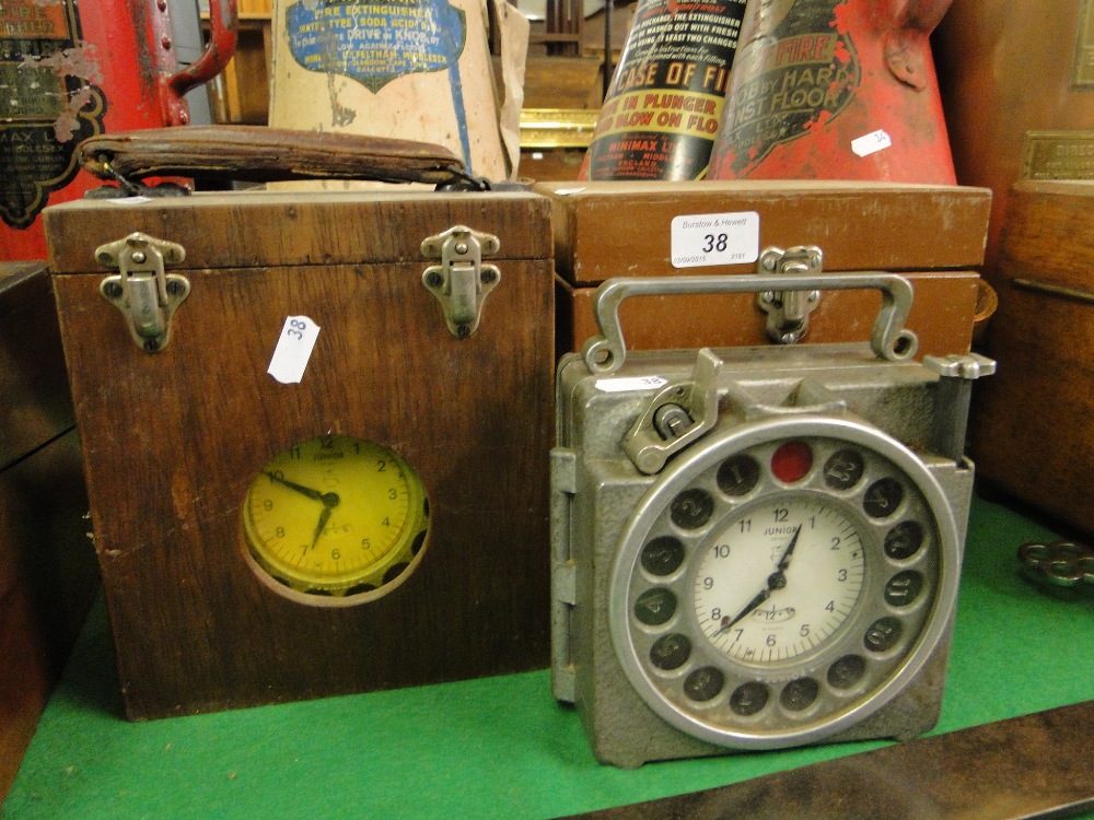 2 cased "Junior" pigeon racing clocks.