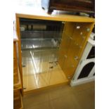 A modern walnut glass display cabinet with 2 doors.