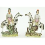 A pair of Victorian Staffordshire horses with jockeys up, 
height 7.25".