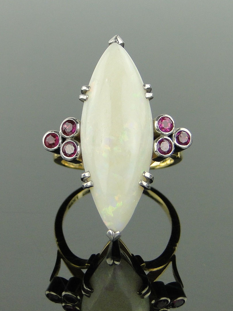18ct gold marquise shaped opal and diamond set ring,
setting height 30mm, size N.