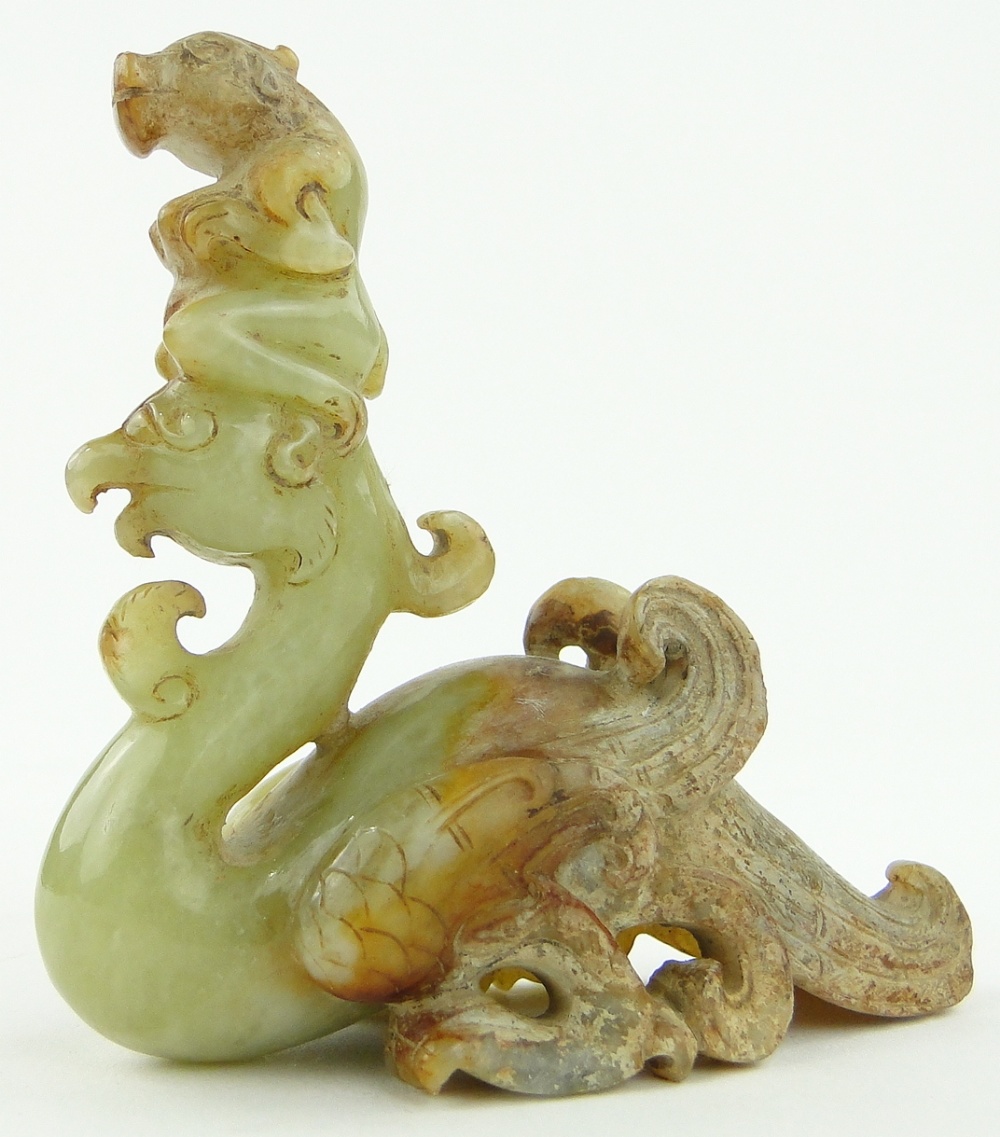 Chinese carved jade phoenix surmounted by a figure,
height 3.1".