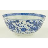 Chinese porcelain blue and white bowl
with dragon design and 4 character mark, diameter 8".