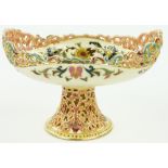 A Zsolnay pedestal comport
with pierced decoration and floral design, height 5.75".