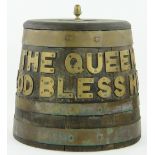 Brass bound oak naval rum barrel,
with applied brass lettering: "The Queen God Bless Her,