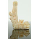 A Chinese carved perfume bottle and stopper
with floral design, height 2.75".