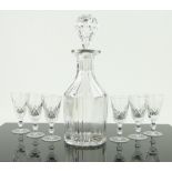 A cut-glass liqueur decanter and stopper,
9.75" and a set of 6 matching glasses.