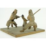 A Chinese carved wood tableau depicting a beheading, 
height 3.5".