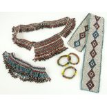 An African beadwork belt,
bangles, etc., (6).