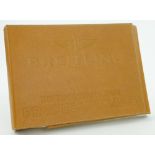 A leather bound Breitling Official Retailer's Catalogue circa 2002.