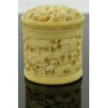 A 19th century finely carved and pierced Chinese ivory pot and cover,
height 1.25".