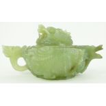 A carved jade teapot
with dragon design, length 8".