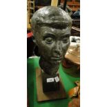 A Sculptured head of a girl 
on oak plinth,