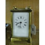 A brass carriage clock.