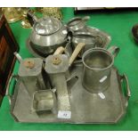 2 pewter teasets on trays.