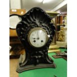 A balloon cased ebonised 2-train mantel clock.