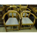 A set of 4 Gothic oak bow arm chairs.