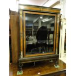 A Victorian walnut and ebonised pier cabinet with single glazed door.