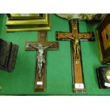 2 crucifixes with metal figures.