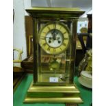 A brass 4 glass mantel clock with 2-train movement.