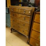 A walnut chest of 4 long drawers on cabriole legs.