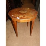 A yewwood octagonal occasional table with inlaid decoration depicting horse and chariot.