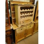 A pine dresser with plate rack, and a pine wine rack.