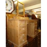 A modern pine twin pedestal dressing table with swing mirror and 8 short drawers.
