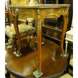 A walnut and kingwood circular centre table, with inlaid decoration,