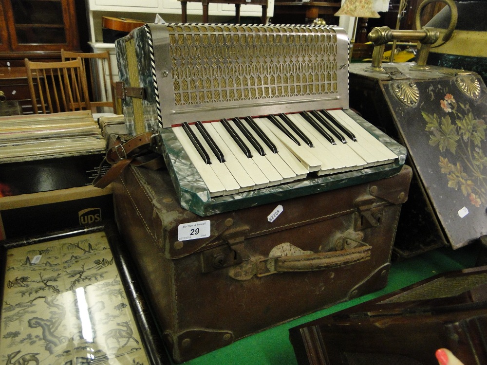 An Alvari piano accordion with case.