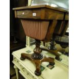 A Regency rosewood sewing table, with rising lid and sliding basket under,