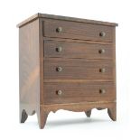 Rosewood miniature chest of drawers in t
