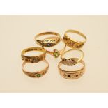 Seven mixed gem set dress rings in 9ct,