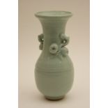 Chinese celadon vase, 19th Century, ovoid form with trumpet neck, with pomegranate branch handles,