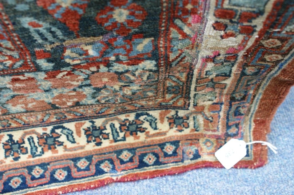 Hamadan woollen carpet, central red medallion against a yellow-fawn ground, - Image 2 of 8