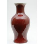 Chinese sang de boeuf vase, late 19th/early 20th Century, baluster form with trumpet neck,