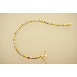 18ct two colour gold and diamond line bracelet, set with alternate links of yellow and white gold,