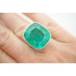 Rare large emerald ring, the cushion shaped stone measuring approx. 21mm x 18mm x 12.