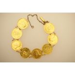 South African gold coin bracelet, set with eight South African half ponds, all 1890s,