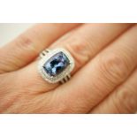 Diamond and tanzanite cluster ring, the central cushion cut tanzanite of approx. 4.