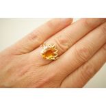 Orange citrine and diamond dress ring in 14ct gold, set with an oval cut citrine of approx.