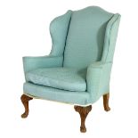 Upholstered wing armchair, upholstered throughout in turquoise fabric,