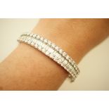 Fine diamond cluster bangle in 18ct white gold,