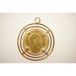 Edwardian half sovereign, 1909, in a 9ct gold pendant mount, weight approx. 7.