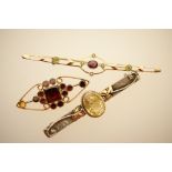 Arts and Crafts style silver and gem set bar brooch, centred with an oval stone of pale yellow,